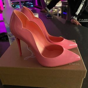 Christian Louboutin red bottoms in bubblegum pink